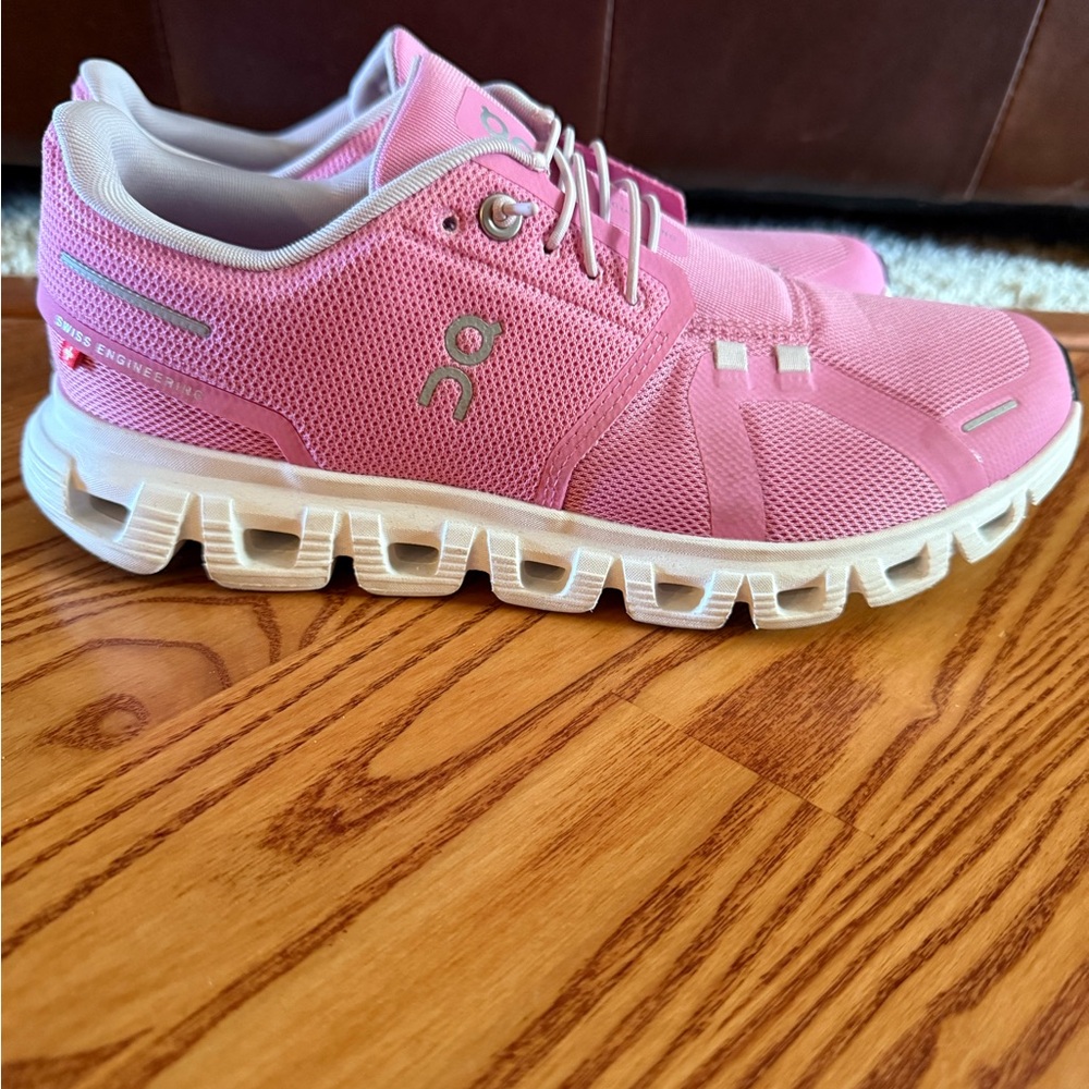 On Running Pink and White Sneakers with Mesh Upper and Flexible Cushioning